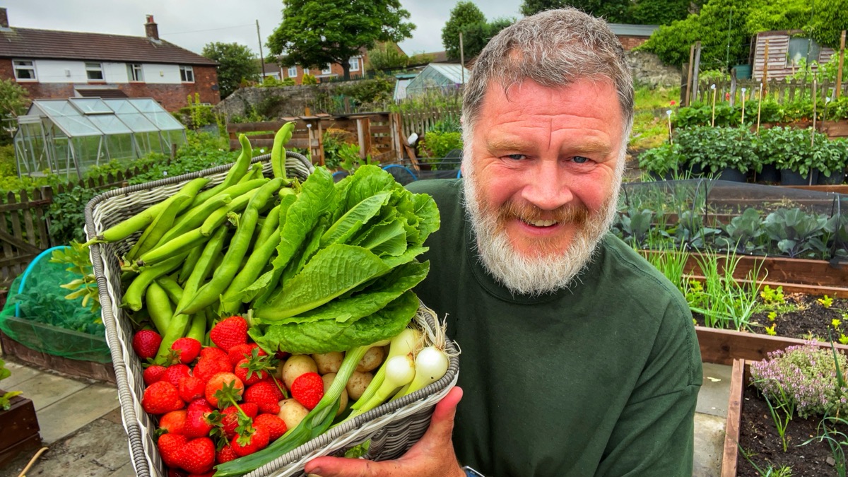 Tony Smith with a basket of home-grown vegetables
